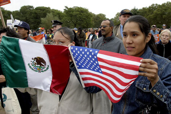 Stan Schnier, Women hold Mexican and American flags at the final Immigrant Workers Freedom Ride event, Flushing Meadows Corona Park, New York, New York, October 4, 2003.  Stan Schnier, Women hold Mexican and American flags at the final Immigrant Workers Freedom Ride event, Flushing Meadows Corona Park, New York, New York, October 4, 2003.