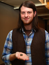 John Hammer, Bo Bennett, UCA student, holding okra seed, Ozark Seed Swap, Mountain View, Arkansas, 2009.  He traded his grandfather’s Moon and Stars watermelon seed at the Swap. John Hammer, Bo Bennett, UCA student, holding okra seed, Ozark Seed Swap, Mountain View, Arkansas, 2009.  He traded his grandfather’s Moon and Stars watermelon seed at the Swap.