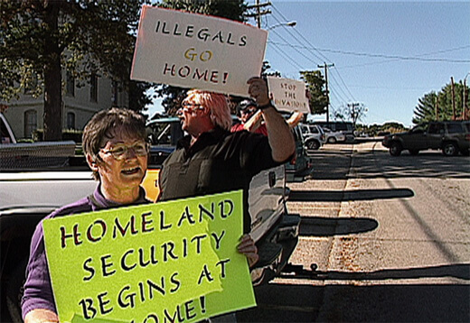 Counter-protesters during a rally for immigrants' rights and against racial profiling in Morristown, 2003, from Morristown: in the air and sun (2007). Counter-protesters during a rally for immigrants' rights and against racial profiling in Morristown, 2003, from Morristown: in the air and sun (2007).