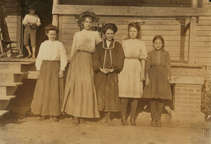 Lewis W. Hine, (From left to right) Lizzie Davis, Nettie Arnet, Monnie McCraney, Vater Arnet, Mattie Connor, Spinners and Winders at Dillons Mills, Dillon, South Carolina, 1908. Courtesy of the Library of Congress, National Child Labor Committee Collection.  Lewis W. Hine, (From left to right) Lizzie Davis, Nettie Arnet, Monnie McCraney, Vater Arnet, Mattie Connor, Spinners and Winders at Dillons Mills, Dillon, South Carolina, 1908. Courtesy of the Library of Congress, National Child Labor Committee Collection.