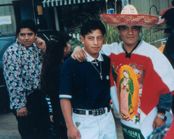 Two men at the Feast Day celebration in honor of Our Lady of Guadalupe, Misión Católica. Doraville, Georgia. Photo by Mary Odem, 2000 Two men at the Feast Day celebration in honor of Our Lady of Guadalupe, Misión Católica. Doraville, Georgia. Photo by Mary Odem, 2000