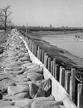Walker Evans, The Bessis Levee, along a subsidiary of the Mississippi River, augmented with sand bags during the 1937 flood, near Tiptonville, Tennessee, February 1937. FSA-OWI Collection, Library of Congress, LC-USF33- 009234-M1. Walker Evans, The Bessis Levee, along a subsidiary of the Mississippi River, augmented with sand bags during the 1937 flood, near Tiptonville, Tennessee, February 1937. FSA-OWI Collection, Library of Congress, LC-USF33- 009234-M1.Walker Evans, The Bessis Levee, along a subsidiary of the Mississippi River, augmented with sand bags during the 1937 flood, near Tiptonville, Tennessee, February 1937. FSA-OWI Collection, Library of Congress, LC-USF33- 009234-M1.
