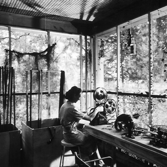 Arnold Eagle, Louisiana Story editor Helen van Dongen operating a Moviola on the porch of the house rented by the Flaherty company, Abbeville, LA, c. 1947. Courtesy of Standard Oil of New Jersey Collection, Special Collections, University of Louisville. Arnold Eagle, Louisiana Story editor Helen van Dongen operating a Moviola on the porch of the house rented by the Flaherty company, Abbeville, LA, c. 1947. Courtesy of Standard Oil of New Jersey Collection, Special Collections, University of Louisville.