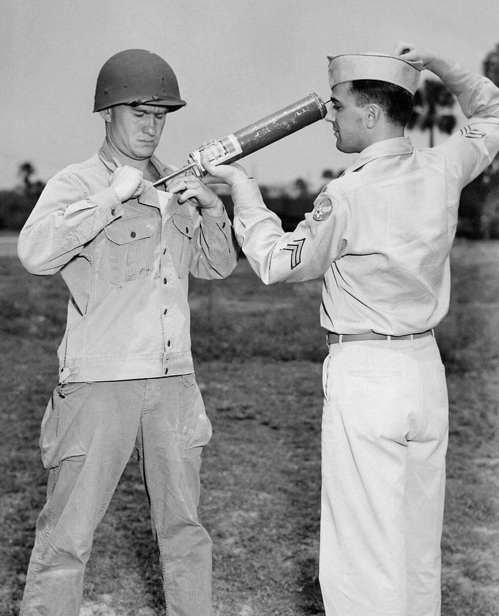 A US soldier is demonstrating DDT-hand spraying equipment while applying the insecticide, ca. 1940s. Courtesy of the CDC Public Health Image Library. Image is in public domain. A US soldier is demonstrating DDT-hand spraying equipment while applying the insecticide, ca. 1940s. Courtesy of the CDC Public Health Image Library. Image is in public domain.