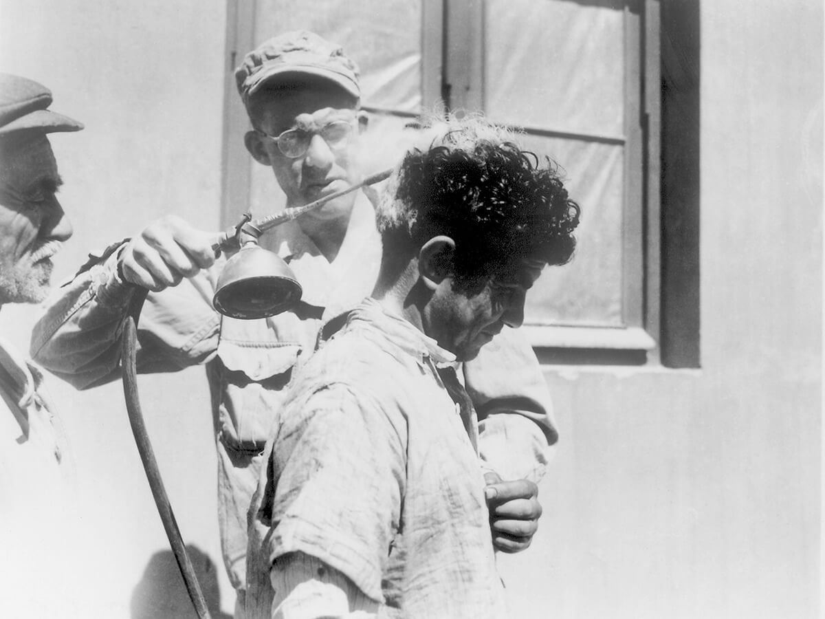 A US Soldier demonstrates the use of DDT-hand spraying equipment. ca. 1940s. Courtesy of the CDC Public Health Image Library. Image is in public domain. A US Soldier demonstrates the use of DDT-hand spraying equipment. ca. 1940s. Courtesy of the CDC Public Health Image Library. Image is in public domain.