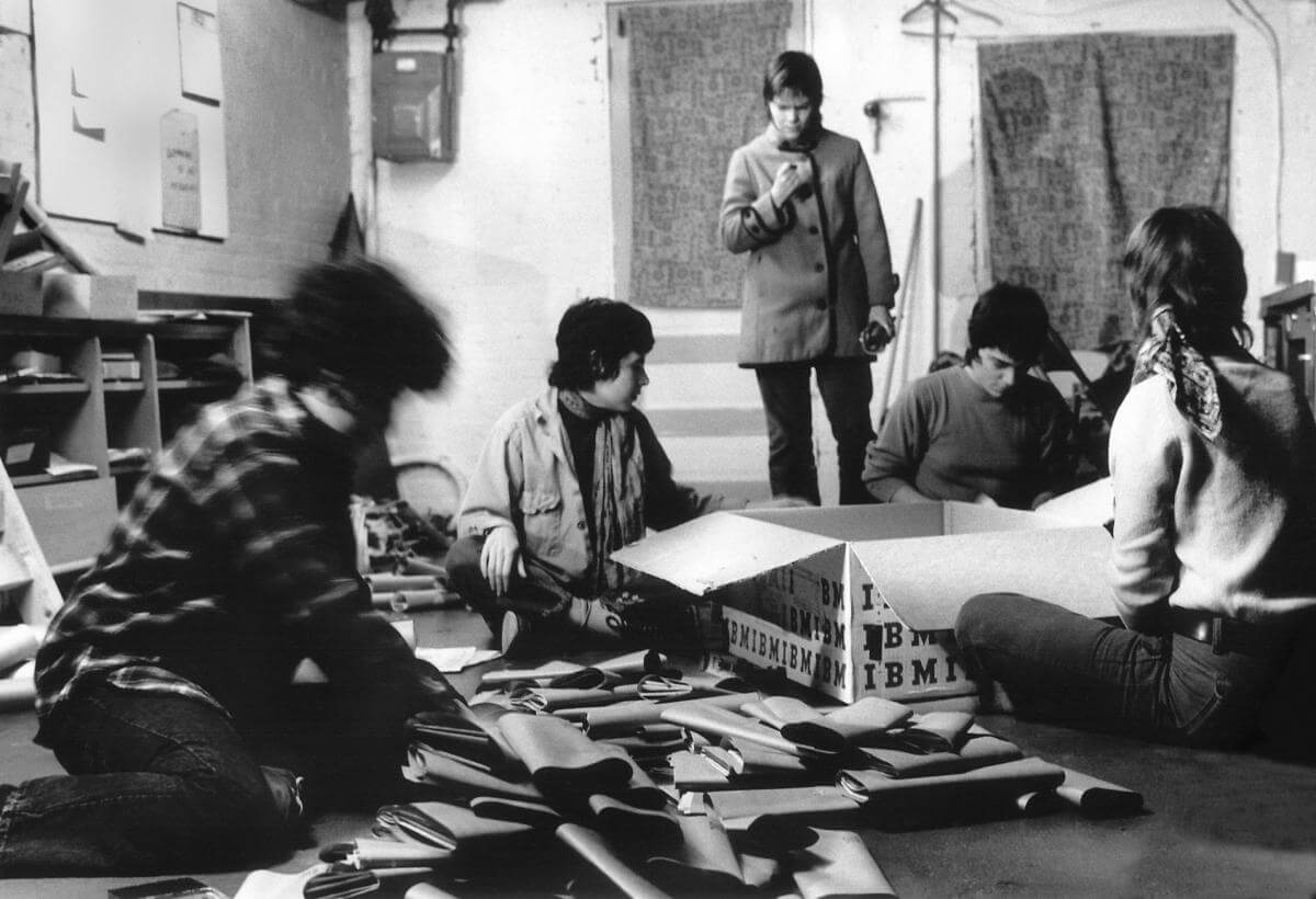 Members of The Furies Collective packing papers in their office basement, Washington, DC, ca. 1971. Photograph by Joan E. Biren. Courtesy of Joan E. Biren and the Sophia Smith Collection of Women's History. From left to right: Ginny Berson, Susan Baker (not a collective member), Coletta Reid (standing), Rita Mae Brown, and Lee Schwing.
