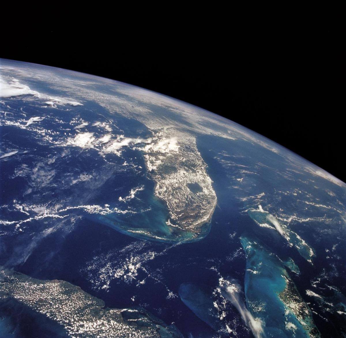 View of the Florida peninsula, western Bahamas, north central Cuba and the deep blue waters of the Gulf Stream, August 8, 1992. Image by Johnson Space Center, National Aeronautics and Space Administration.  View of the Florida peninsula, western Bahamas, north central Cuba and the deep blue waters of the Gulf Stream, August 8, 1992. Image by Johnson Space Center, National Aeronautics and Space Administration.