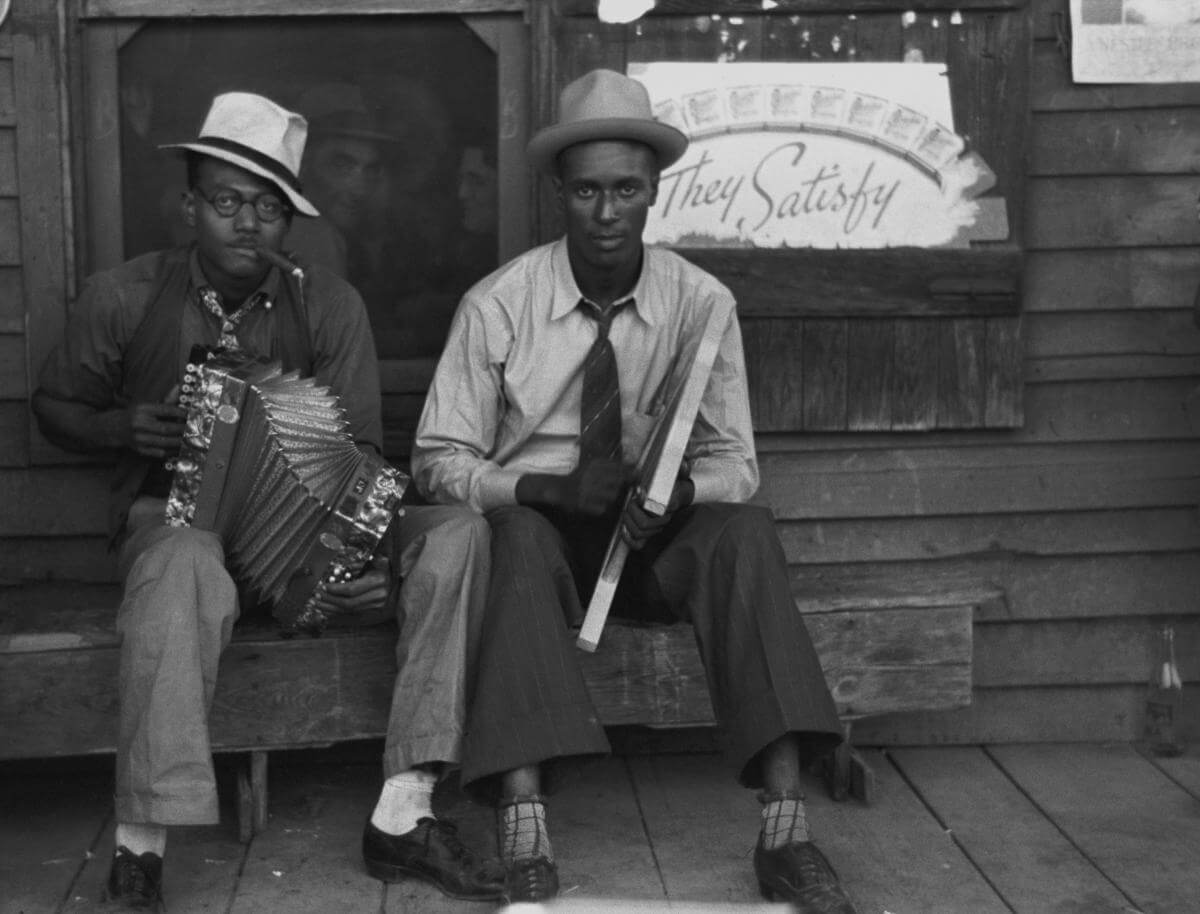 Negro musicians playing accordion and washboard in front of store, near New Iberia, Louisiana, 1938. Photograph by Russell Lee. Courtesy of Farm Security Administration/Office of War Information Black-and-White Negatives. Library of Congress Prints and Photographs Division Washington, DC. Negro musicians playing accordion and washboard in front of store, near New Iberia, Louisiana, 1938. Photograph by Russell Lee. Courtesy of Farm Security Administration/Office of War Information Black-and-White Negatives. Library of Congress Prints and Photographs Division Washington, DC.