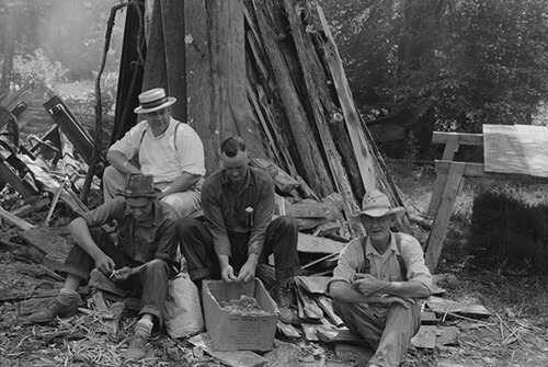 Marion Post Wolcott, Parishoners peeling potatoes for a benefit picnic supper on the grounds of St. Thomas' Church, near Bardstown, Kentucky, August 7, 1940. Library of Congress Prints and Photographs Division, FSA/OWI Black & White Negatives Collection, LC-USF33-030969-M3. 