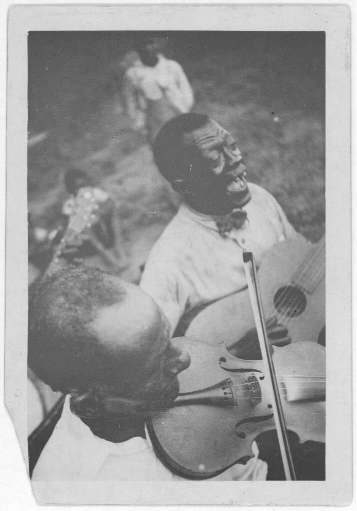 Wilson "Stavin' Chain" Jones playing guitar and singing the ballad "Batson" alongside fiddler Octave Amos, Lafayette, Louisiana, 1934. Photograph by Alan Lomax. The Lomax Collection, Library of Congress. Courtesy of The Library of Congress, Prints and Photographs Division, LC-DIG-ppmsc-00340.  Wilson "Stavin' Chain" Jones playing guitar and singing the ballad "Batson" alongside fiddler Octave Amos, Lafayette, Louisiana, 1934. Photograph by Alan Lomax. The Lomax Collection, Library of Congress. Courtesy of The Library of Congress, Prints and Photographs Division, LC-DIG-ppmsc-00340.