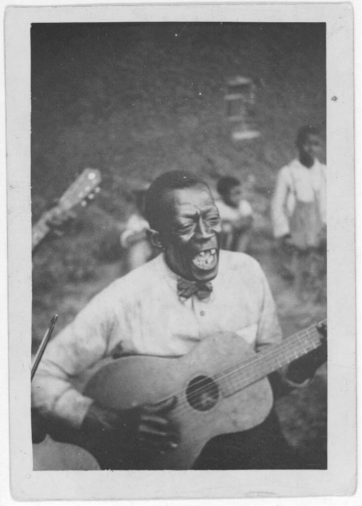 Wilson "Stavin' Chain" Jones playing guitar and singing the ballad "Batson," Lafayette, Louisiana, 1934. Photograph by Alan Lomax. The Lomax Collection, Library of Congress. Courtesy of The Library of Congress, Prints and Photographs Division, LC-DIG-ppmsc-00341. Wilson "Stavin' Chain" Jones playing guitar and singing the ballad "Batson," Lafayette, Louisiana, 1934. Photograph by Alan Lomax. The Lomax Collection, Library of Congress. Courtesy of The Library of Congress, Prints and Photographs Division, LC-DIG-ppmsc-00341.