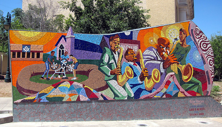 Detail of Rhapsody, a fifty-foot-long mosaic mural located in Urdy Plaza, Austin, Texas. Mural by John Yancy, master artisan Luis G. Alicea, and artist Stephen B. Jones, 2004. Photograph by Flickr user Wally Gobetz, August, 17, 2012 (CC BY-NC-ND 2.0). Detail of Rhapsody, a fifty-foot-long mosaic mural located in Urdy Plaza, Austin, Texas. Mural by John Yancy, master artisan Luis G. Alicea, and artist Stephen B. Jones, 2004. Photograph by Flickr user Wally Gobetz, August, 17, 2012 (CC BY-NC-ND 2.0).
