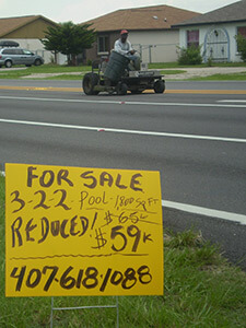 For Sale sign, Buenaventura Lakes, Florida, 2010. Photograph by Simone Delerme. For Sale sign, Buenaventura Lakes, Florida, 2010. Photograph by Simone Delerme.