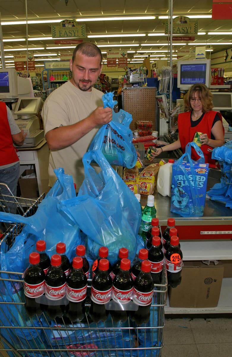 Coal miner buys groceries for his family at Buffalo Creek Supermarket. Logan County, WV, 2005. Coal miner buys groceries for his family at Buffalo Creek Supermarket. Logan County, WV, 2005.