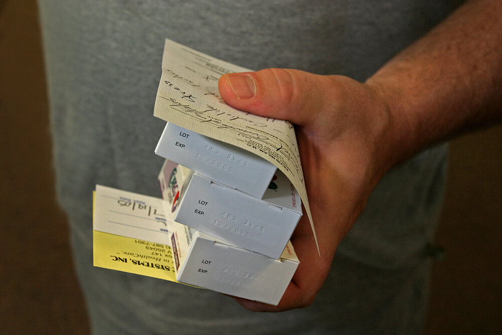 Miner holds medications and prescriptions for hypertension and stress. Clay Primary Health Care Clinic, Clay, WV, 2005. Miner holds medications and prescriptions for hypertension and stress. Clay Primary Health Care Clinic, Clay, WV, 2005.