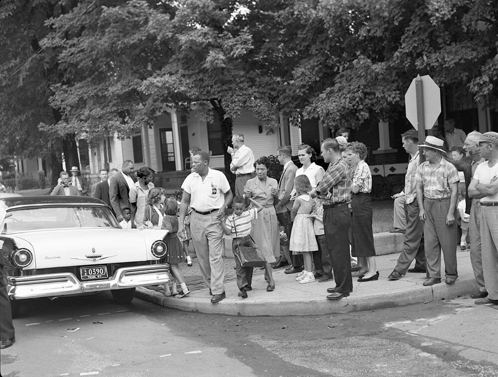 The parents of six-year-old Sinclair Lee, Jr., lead their son to Glenn Elementary, Nashville, TN, September 1957. © Nashville Public Library. The parents of six-year-old Sinclair Lee, Jr., lead their son to Glenn Elementary, Nashville, TN, September 1957. © Nashville Public Library.