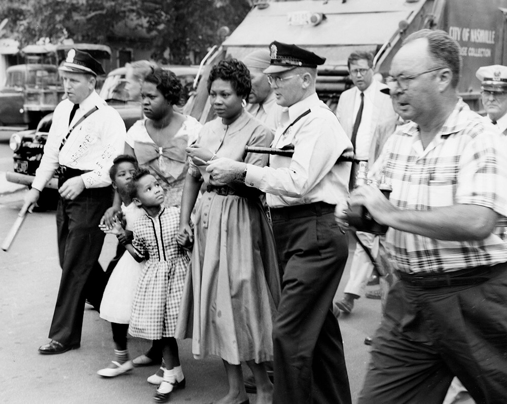 Police and reporters surround parents and children at Fehr Elementary, Nashville, TN, September 1957. © Nashville Public Library. Police and reporters surround parents and children at Fehr Elementary, Nashville, TN, September 1957. © Nashville Public Library.