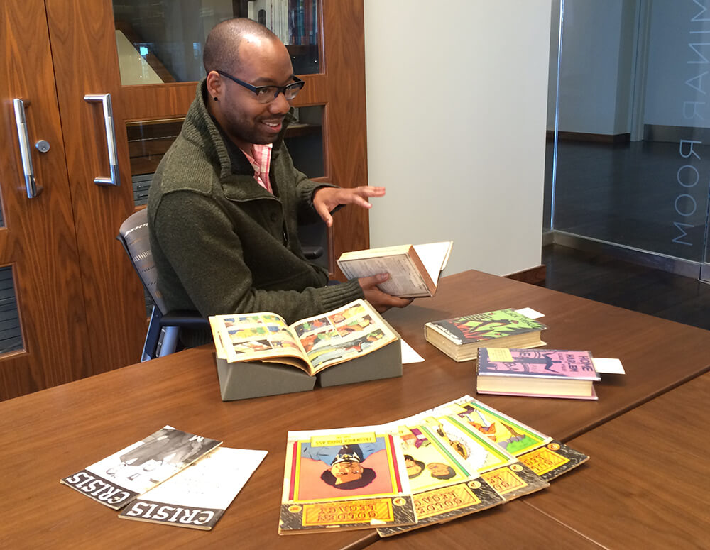 Clint Fluker exploring archival materials at Emory University's Stuart A. Rose Manuscript, Archives, and Rare Book Library, March 29, 2016. Photograph by Kelly Gannon. Courtesy of Kelly Gannon. Clint Fluker exploring archival materials at Emory University's Stuart A. Rose Manuscript, Archives, and Rare Book Library, March 29, 2016. Photograph by Kelly Gannon. Courtesy of Kelly Gannon.