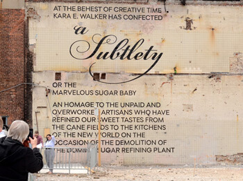 Wall text for Kara Walker's A Subtlety, Brooklyn, New York, May 18, 2014. Photograph by Ann Hilton Fisher. Courtesy of Ann Hilton Fisher. Wall text for Kara Walker's A Subtlety, Brooklyn, New York, May 18, 2014. Photograph by Ann Hilton Fisher. Courtesy of Ann Hilton Fisher.