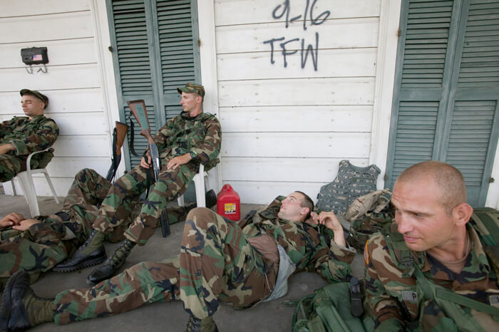 FEMA News Photo, New Orleans, Louisiana, September 20, 2005. Photograph by Andrea Booher. "Exhausted National Guardsmen take a break from patrolling isolated communities around New Orleans. Only residents and emergency workers are allowed access following Hurricane Katrina" (FEMA caption). FEMA News Photo, New Orleans, Louisiana, September 20, 2005. Photograph by Andrea Booher. "Exhausted National Guardsmen take a break from patrolling isolated communities around New Orleans. Only residents and emergency workers are allowed access following Hurricane Katrina" (FEMA caption).