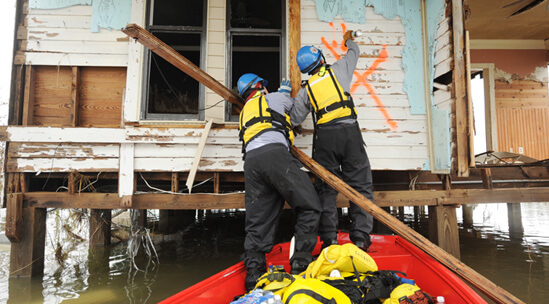 FEMA News Photo, Sabine Pass, Texas, September 14, 2008. Photograph by Jocelyn Augustino. "FEMA Urban Search and Rescue Indiana Task Force 1 marks a house as they conduct a search in a neighborhood impacted by Hurricane Ike" (FEMA caption). FEMA News Photo, Sabine Pass, Texas, September 14, 2008. Photograph by Jocelyn Augustino. "FEMA Urban Search and Rescue Indiana Task Force 1 marks a house as they conduct a search in a neighborhood impacted by Hurricane Ike" (FEMA caption).
