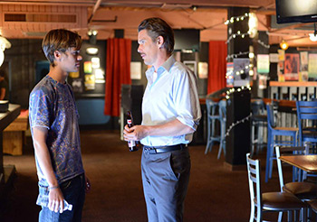 Mason Sr. (Ethan Hawke) and Mason Jr. share a moment inside an empty rock club near the end of the film, 2014. © IFC Films. Mason Sr. (Ethan Hawke) and Mason Jr. share a moment inside an empty rock club near the end of the film, 2014. © IFC Films.