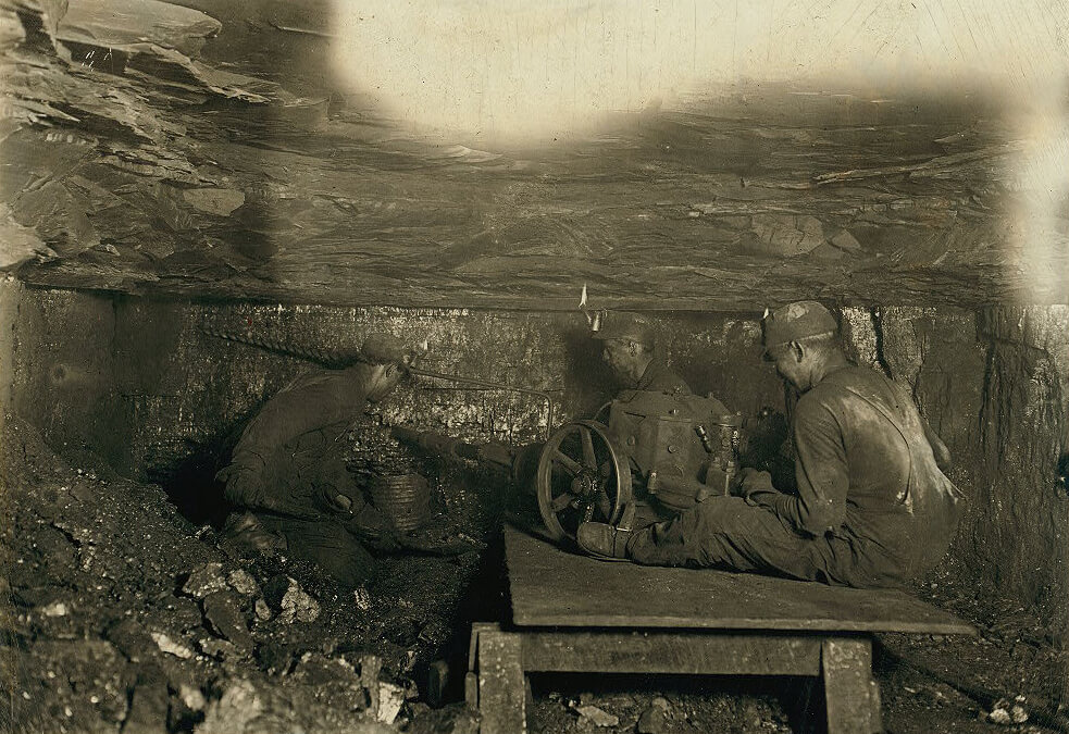 Man digging coal by machinery low ceiling, Brown, West Virginia, 1908. Photographic print by Lewis Wickes Hine. Courtesy of the Library of Congress Prints and Photographs Division, loc.gov/resource/nclc.01060. Man digging coal by machinery low ceiling