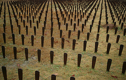 A symbolic representation of the more than 25,000 patients buried in unmarked graves on the Central State Hospital grounds in Milledgeville, Georgia. Photograph by John Kloepper. Creative Commons Liscense CC-BY-3.0. A symbolic representation of the more than 25,000 patients buried in unmarked graves on the Central State Hospital grounds in Milledgeville, Georgia. Photograph by John Kloepper. Creative Commons Liscense CC-BY-3.0.