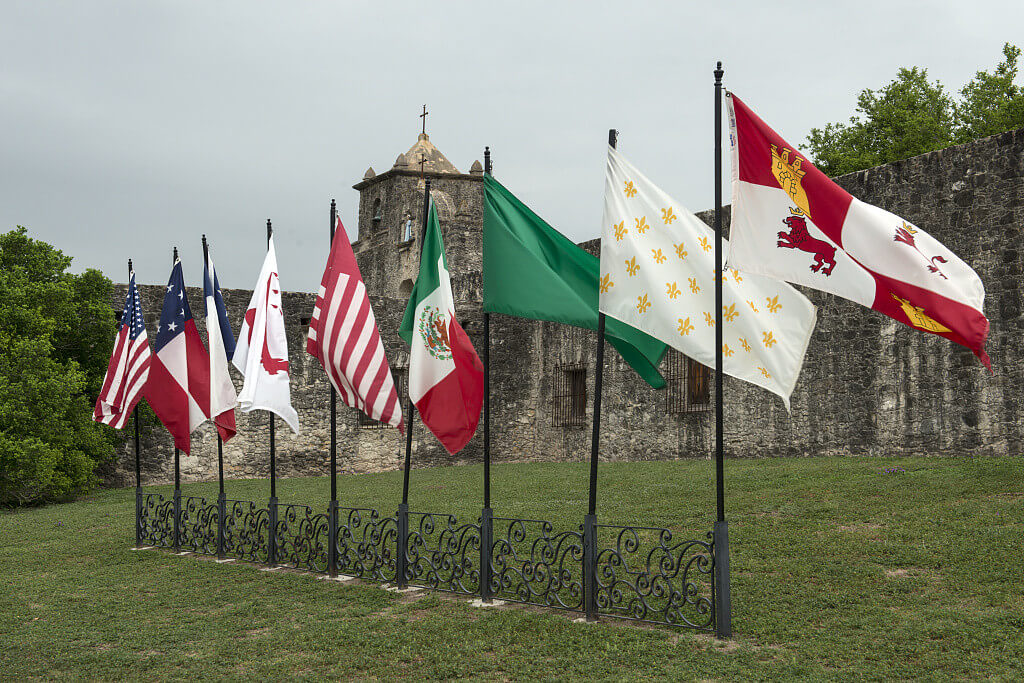Nine flags, Presidio La Bahia, Goliad, Texas, April 5, 2014. Photograph by Carol M. Highsmith. Courtesy of the Carol M. Highsmith Collection, Library of Congress Prints and Photographs Division, http://www.loc.gov/resource/highsm.29287/.  The flags, pictured left to right, represent states and revolutionary forces that once ruled Texas territory: the United States of America, the Confederate States of America, the Republic of Texas, Captain Phillip Dimmitt's Goliad Insurrection, James Long's Second Republic of Texas, Mexico, the First Republic of Texas, France, and Spain. Nine flags, Presidio La Bahia, Goliad, Texas, April 5, 2014. Photograph by Carol M. Highsmith. Courtesy of the Carol M. Highsmith Collection, Library of Congress Prints and Photographs Division, http://www.loc.gov/resource/highsm.29287/.  The flags, pictured left to right, represent states and revolutionary forces that once ruled Texas territory: the United States of America, the Confederate States of America, the Republic of Texas, Captain Phillip Dimmitt's Goliad Insurrection, James Long's Second Republic of Texas, Mexico, the First Republic of Texas, France, and Spain.