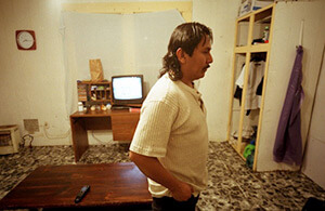 At home after a long day of work, Scott County, Mississippi, 2004. Photograph by John Fiege. Courtesy of John Fiege. At home after a long day of work, Scott County, Mississippi, 2004. Photograph by John Fiege. Courtesy of John Fiege.