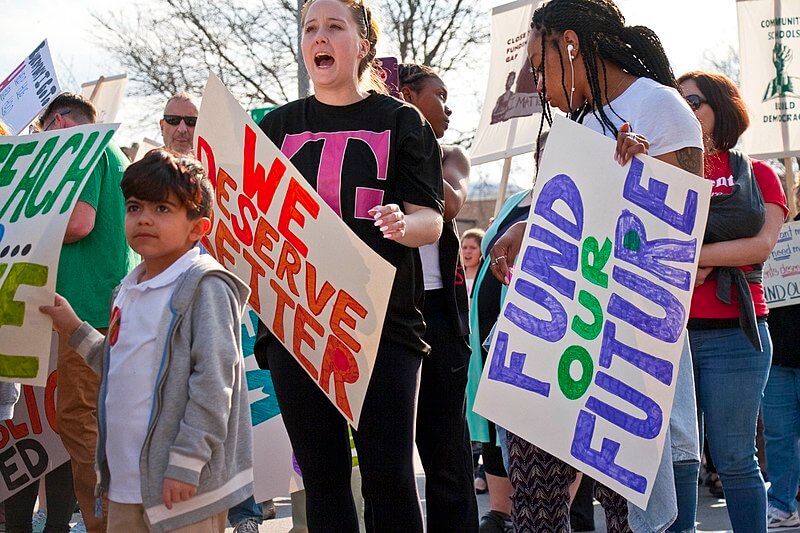 Public school teachers and supporters picket outside Milwaukee Public Schools administration building, Milwaukee, Wisconsin, April 24, 2018. Photograph by Charles Edward Miller. Courtesy of Wikimedia Commons. Creative Commons license CC BY-SA 2.0.
