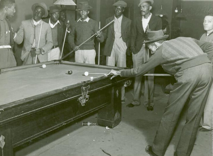 Shooting pool on a Saturday afternoon, Clarksdale, Mississippi Delta, Mississippi, November 1939. Photograph by Marion Post Wolcott. Courtesy of The New York Public Library, Schomburg Center for Research in Black Culture, Photographs and Prints Division, digitalcollections.nypl.org/items/510d47df-f8dc-a3d9-e040-e00a18064a99. Shooting pool on a Saturday afternoon, Clarksdale, Mississippi Delta, Mississippi, November 1939. Photograph by Marion Post Wolcott. Courtesy of The New York Public Library, Schomburg Center for Research in Black Culture, Photographs and Prints Division, digitalcollections.nypl.org/items/510d47df-f8dc-a3d9-e040-e00a18064a99.