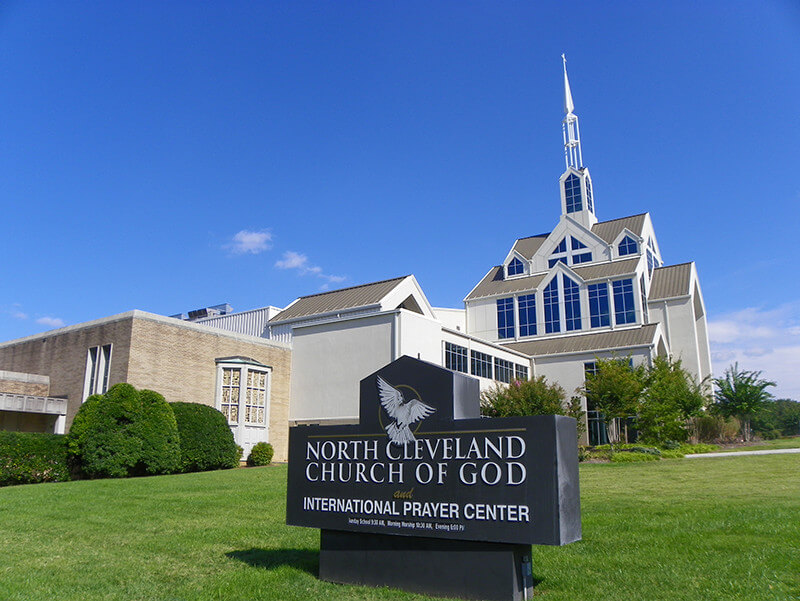 North Cleveland Church of God, Cleveland, Tennessee, September 30, 2010. Photograph by Flickr user J. Stephen Conn. Creative Commons license CC BY-NC 2.0 Photograph of North Cleveland Church of God, a large white building with tall windows and a white steeple.