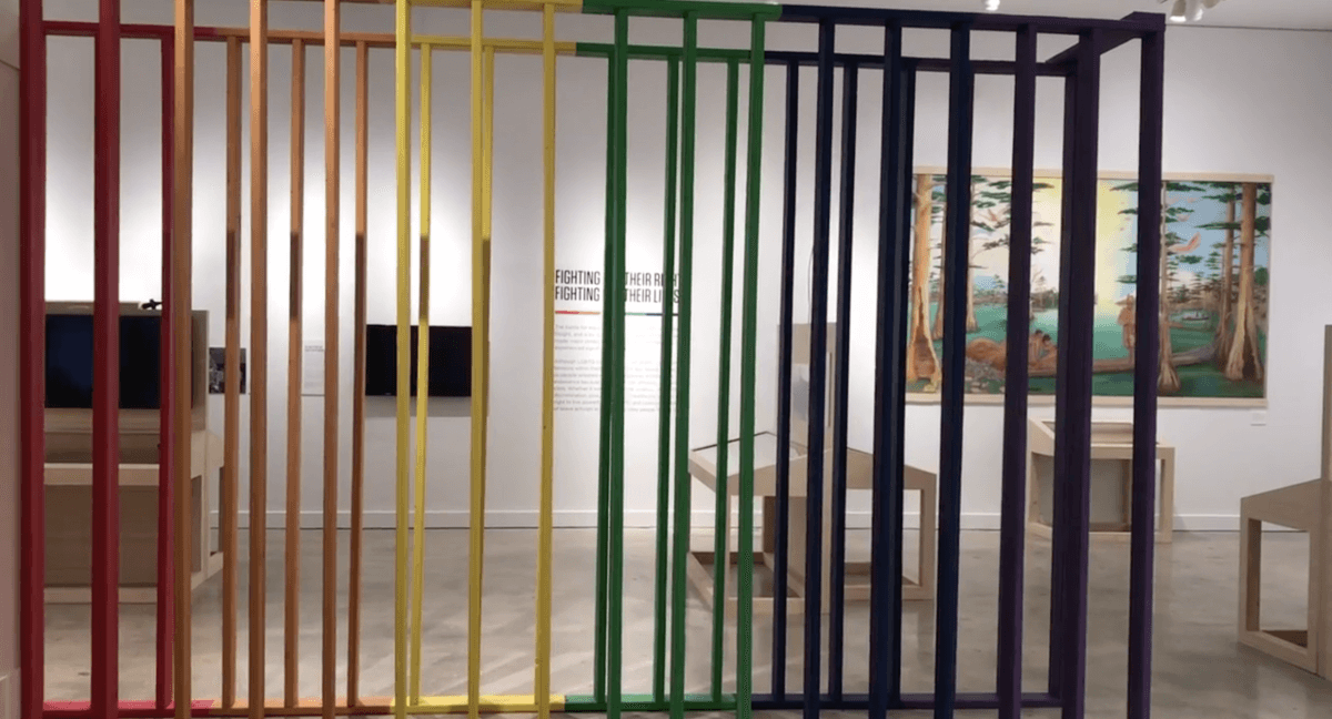 Rainbow art partition at the Queer Miami exhibition, Florida, 2019. Photograph by HistoryMiami Museum. Courtesy of HistoryMiami Museum. Rainbow art partition at the Queer Miami exhibition