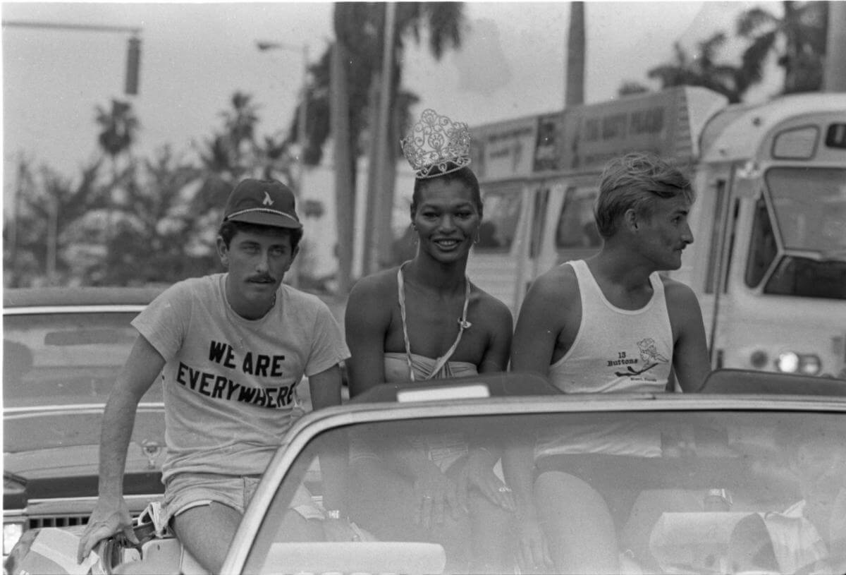 Three participants riding in a car in Miami's first Gay Rights Parade, Miami, Florida, 1978. Photograph by Tim Chapman. Courtesy of the Tim Chapman Collection, HistoryMiami Museum. Three participants riding in a car in Miami's first Gay Rights Parade