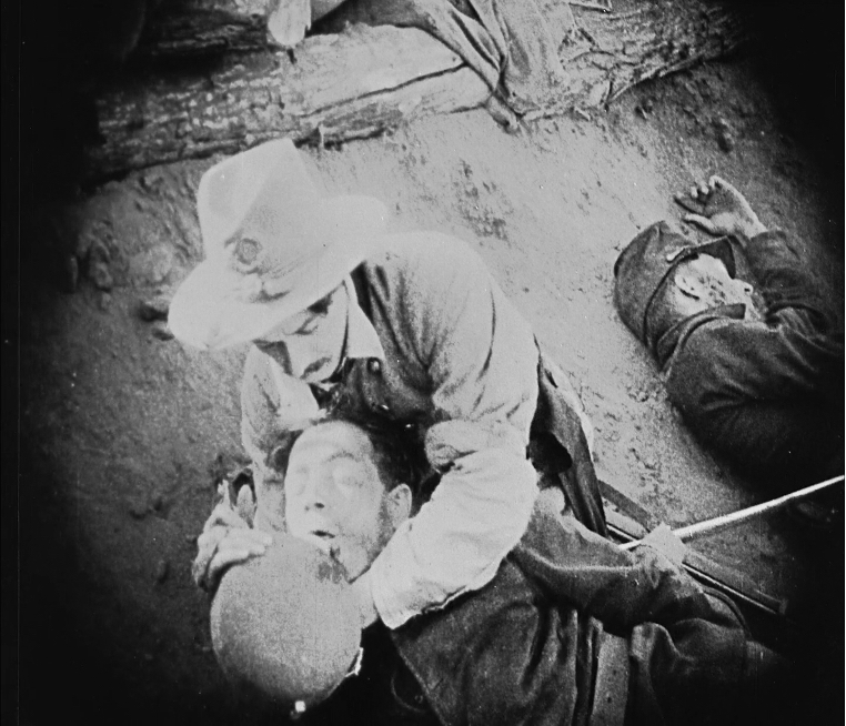 Ben Cameron, a fictional Confederate colonel, chivalrously shares his canteen with a wounded Union warrior in D. W. Griffith's reenactment of the Battle of Petersburg