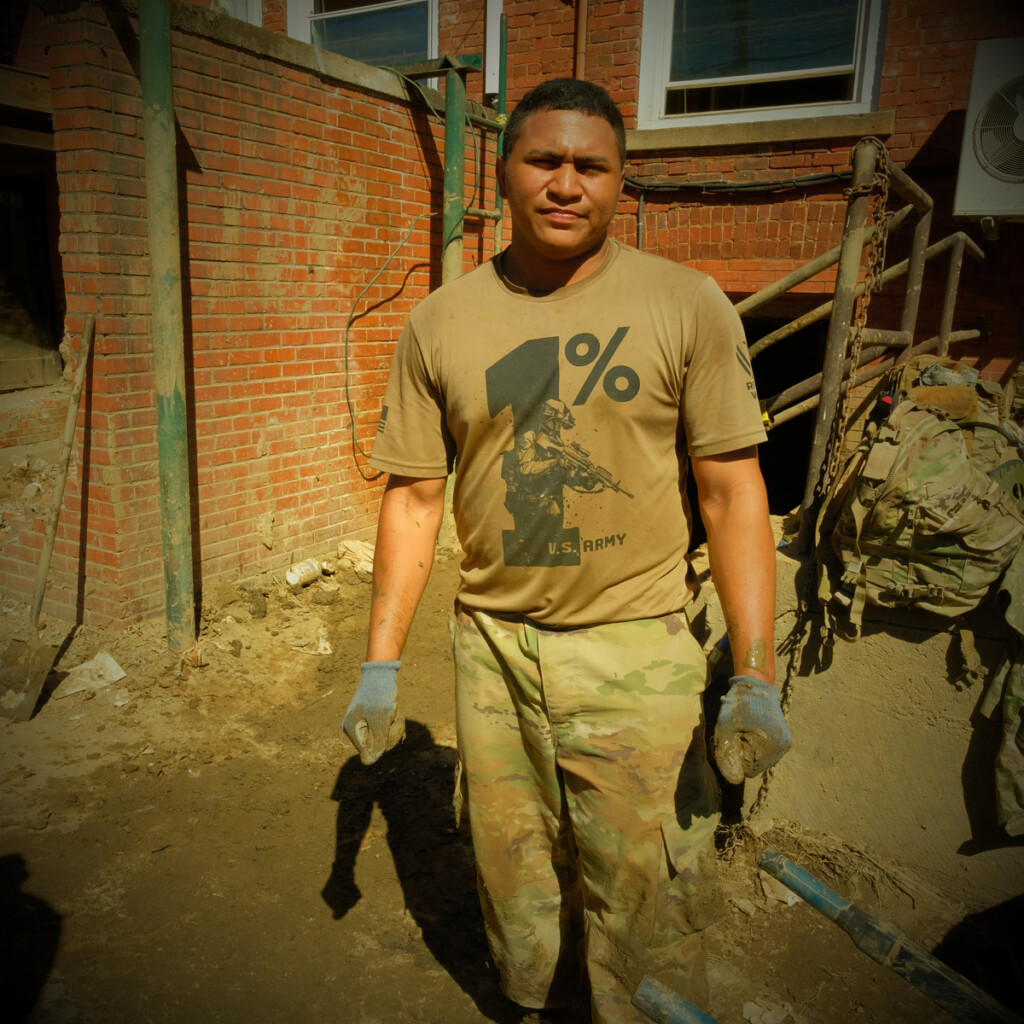 Member of the 101st Airborne Division from Ft. Campbell, Kentucky, mucking the basement of the Madison County Arts Council building on Main Street in downtown Marshall, North Carolina, after Hurricane Helene.